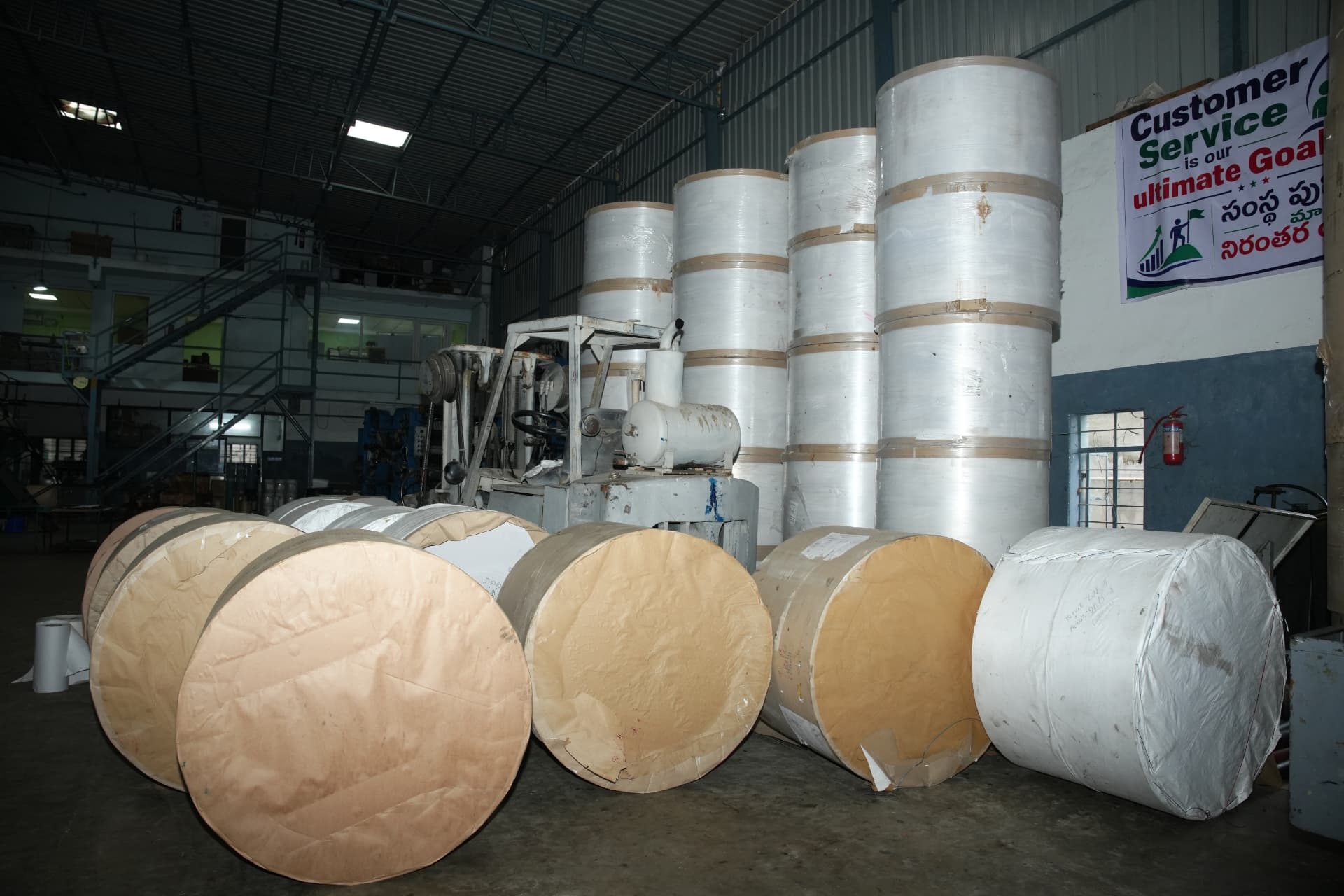 Newsprint reel storage and forklift handling